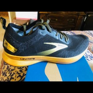 Brooks levitate black and gold running shoes